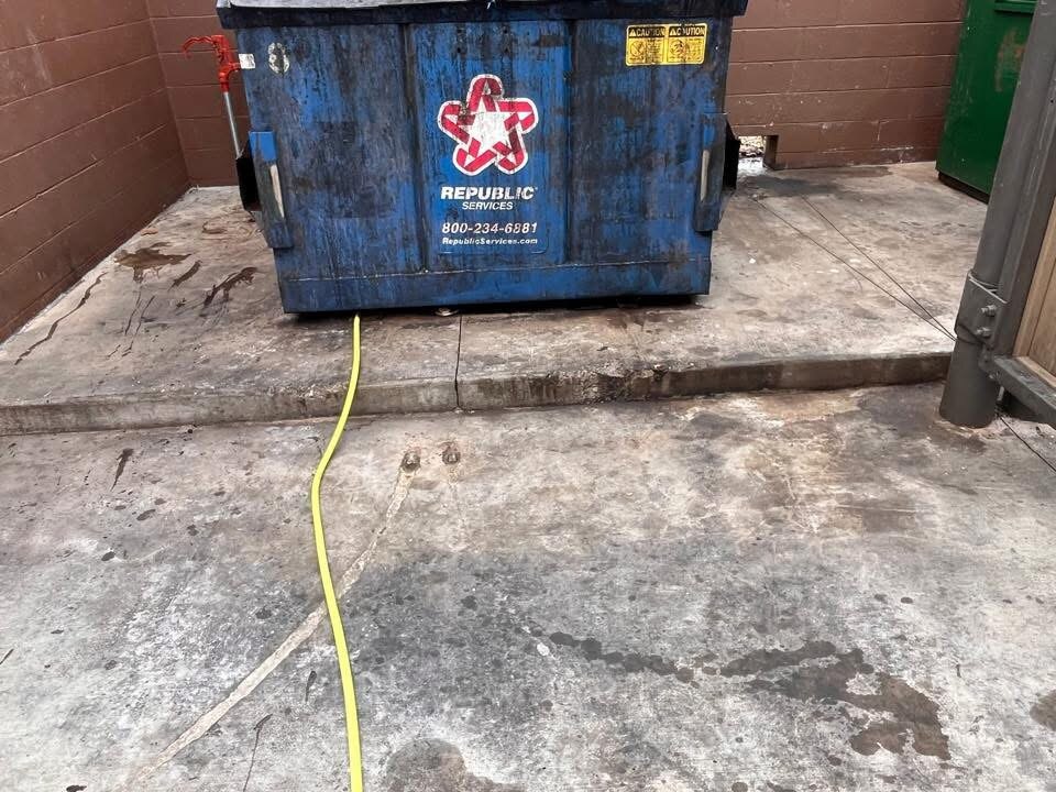 Before: Commercial dumpster pad