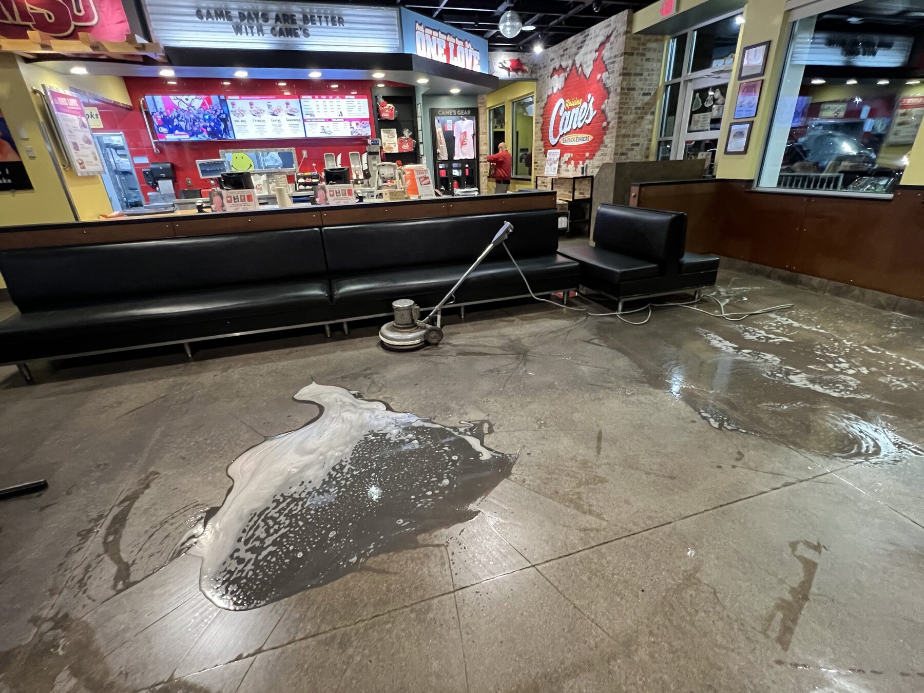 Interior floor scrubber and soap on a commercial dining floor